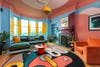 Living room with pink and turquoise mural