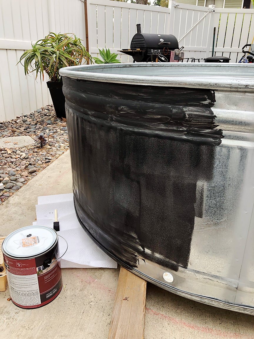 metal pool being painted black