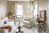 living room with antique plaster wallpaper, white furniture, antique table