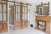 antique sliding doors and vintage fireplace