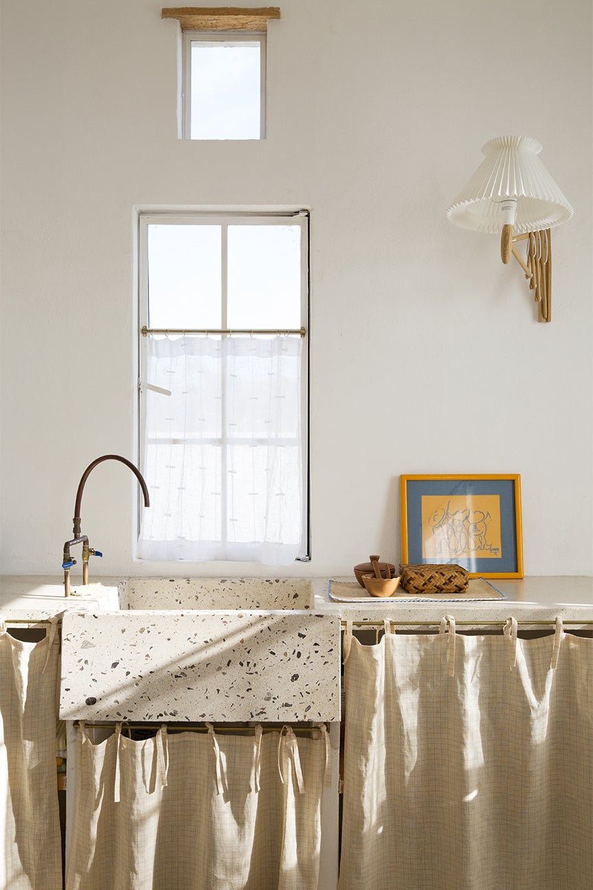 stone sink with linen sink skirt