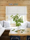 Cedar-paneled room with white banquette