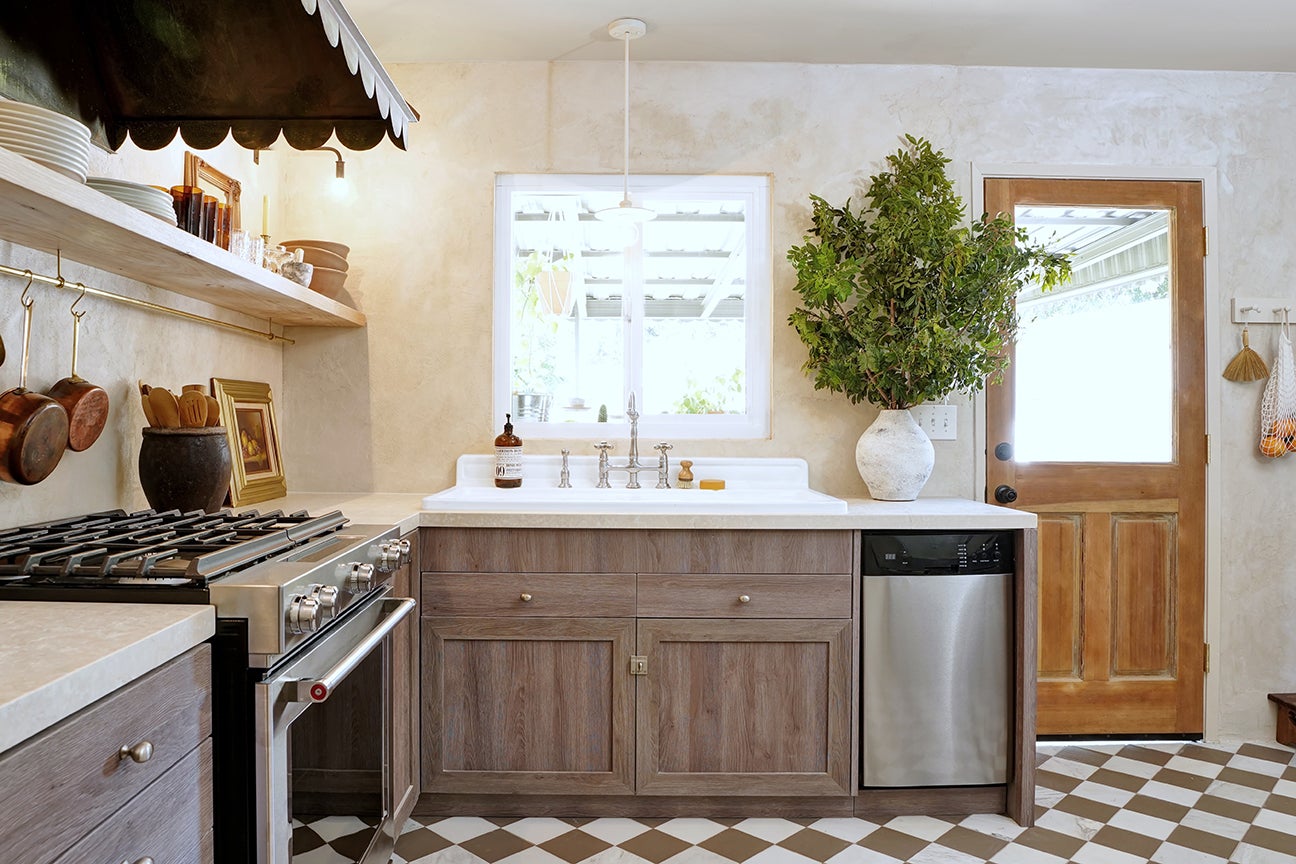 French country kitchen with checkerboard floors and wood cabinets
