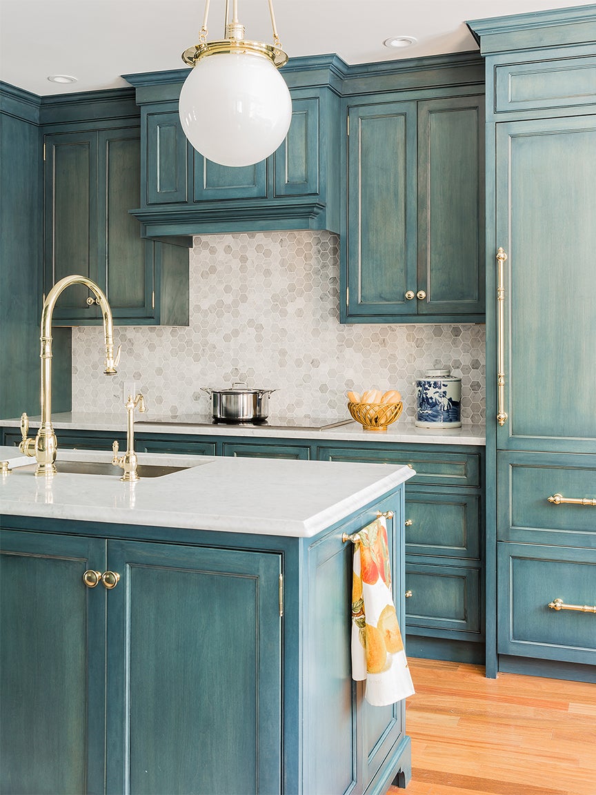 teal kitchen with distressed cabinets