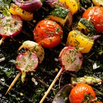 Vegetable kebabs on grill