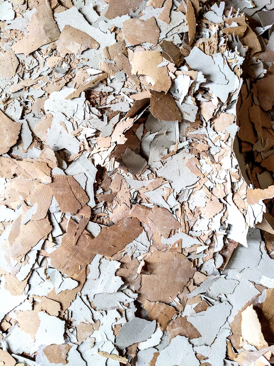 chips of old wallpaper on floor