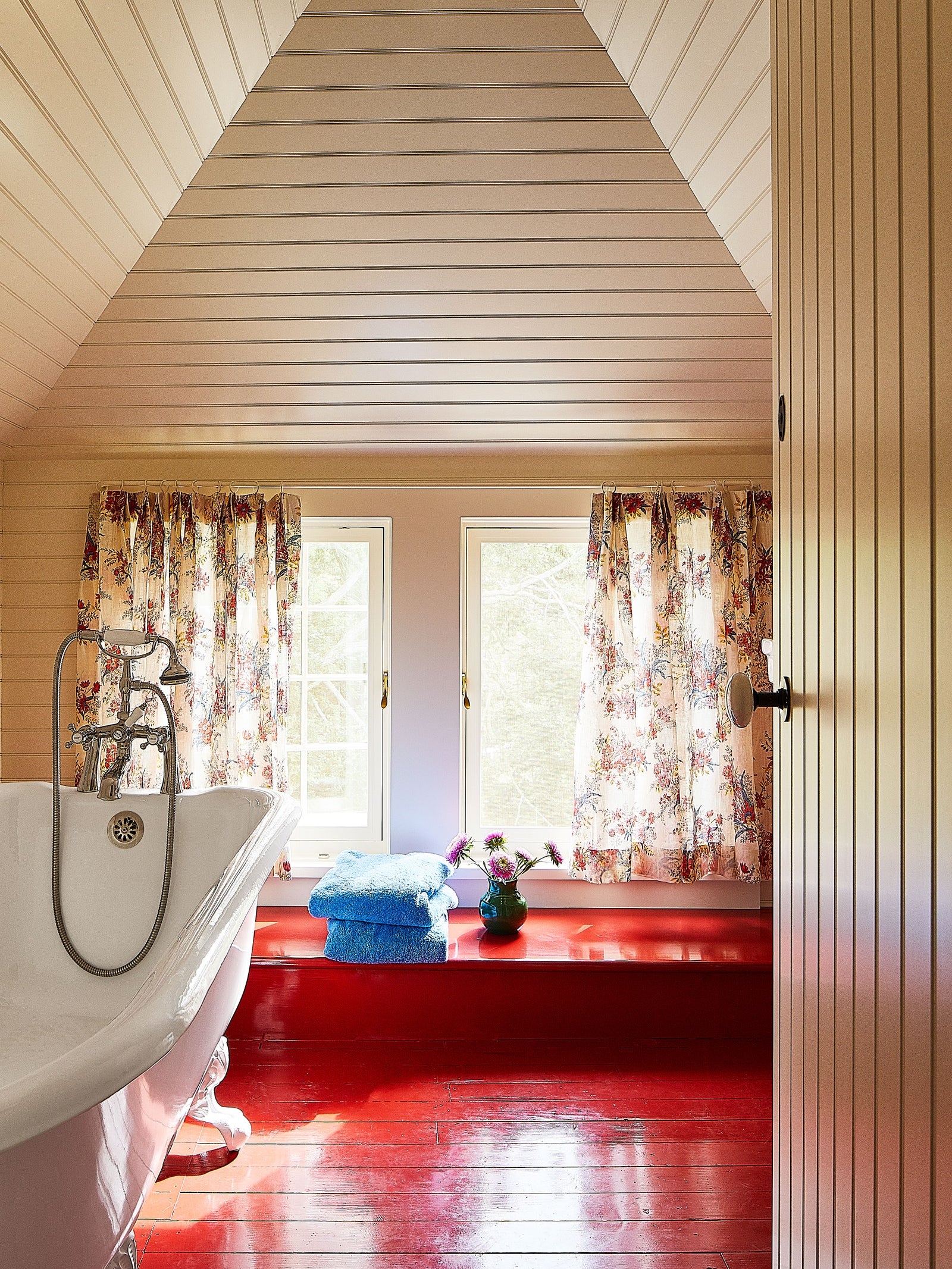 Country bathroom with red painted floors