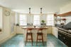 farmhouse style kitchen with blue floors