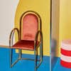 red chair against yellow wall