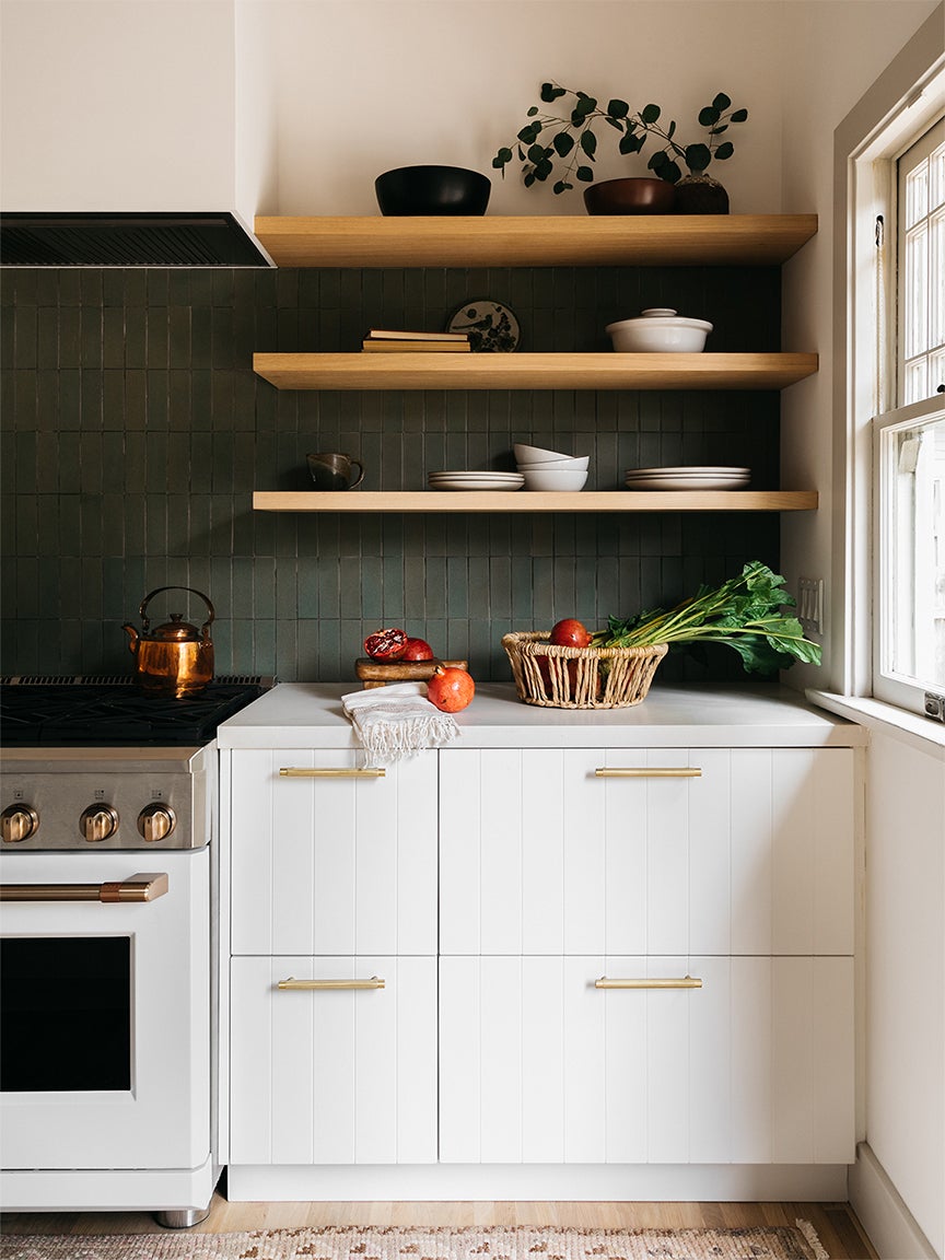 white kitchen cabinets wood open shelves and dark charcoal backsplash