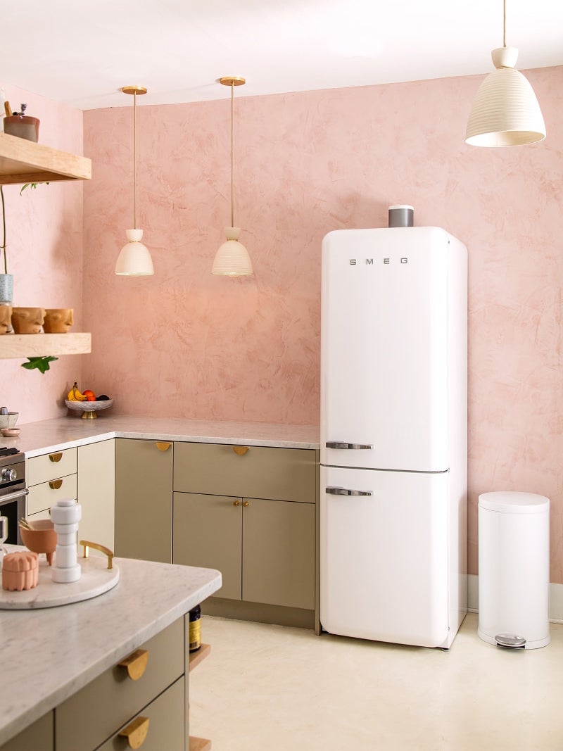 pink kitchen plaster walls white smeg fridge