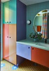 multicolored bathroom with green tile backsplash