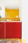 yellow zellige tile backsplash red cabinet
