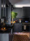 Dark kitchen with terracotta floors