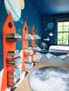 Kids room with rocket shelves