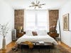 bedroom with exposed brick