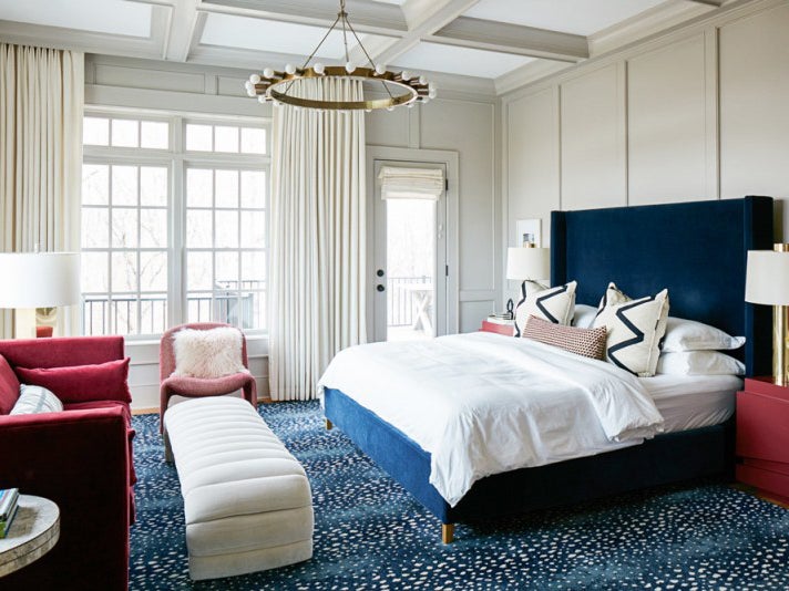 blue rug in large bedroom