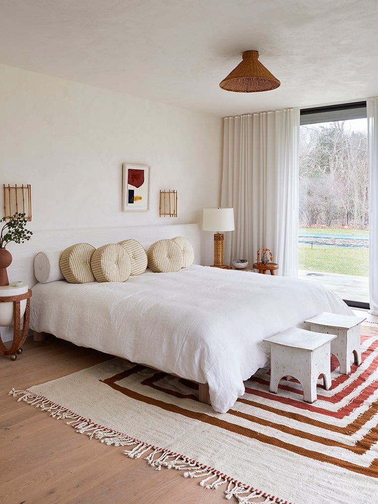 breezy bedroom with white and red tones