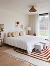 breezy bedroom with white and red tones