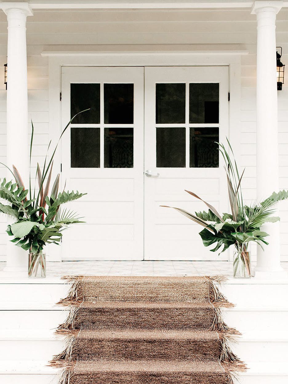 white home with jute carpet on stairs