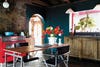 teal kitchen with antique cabinets and red stove