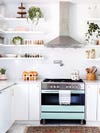 Sleek white kitchen with open shelves