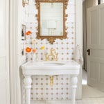 white tile vintage gilded mirror bathroom