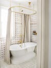 beige vintage bathroom with standalone tub