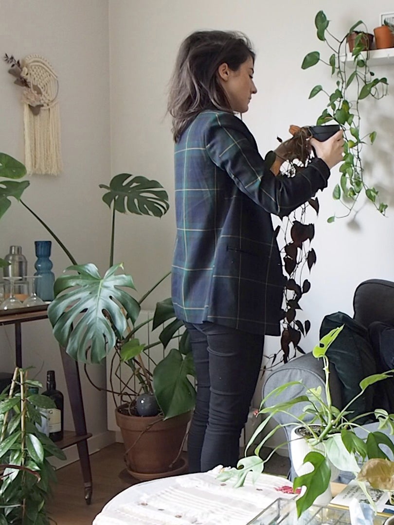 woman in room with plants