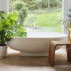 tub surrounded by plants