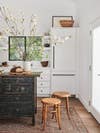 white kitchen with distressed wood island