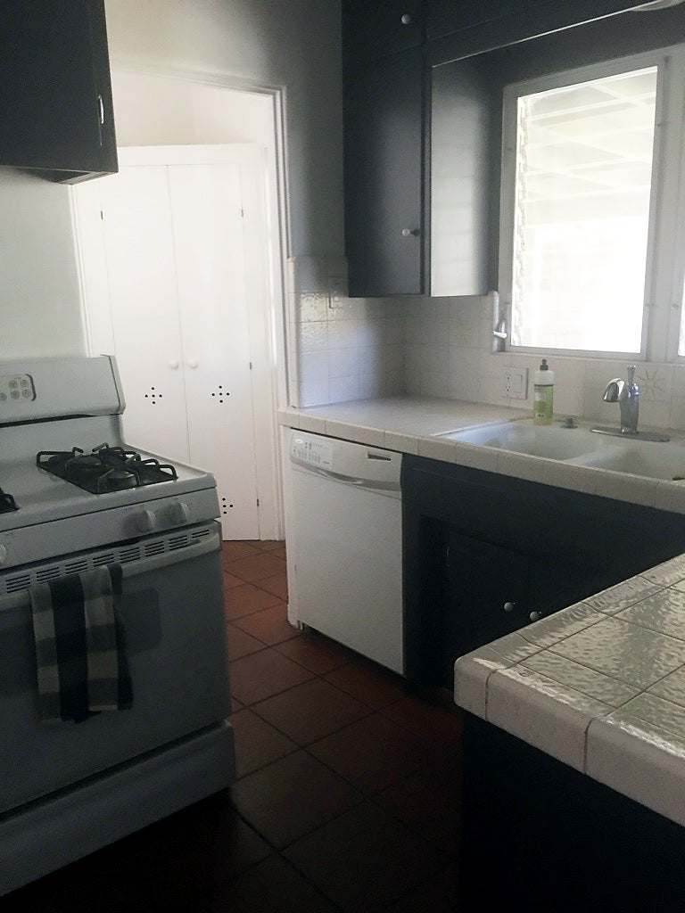 tiny dated kitchen