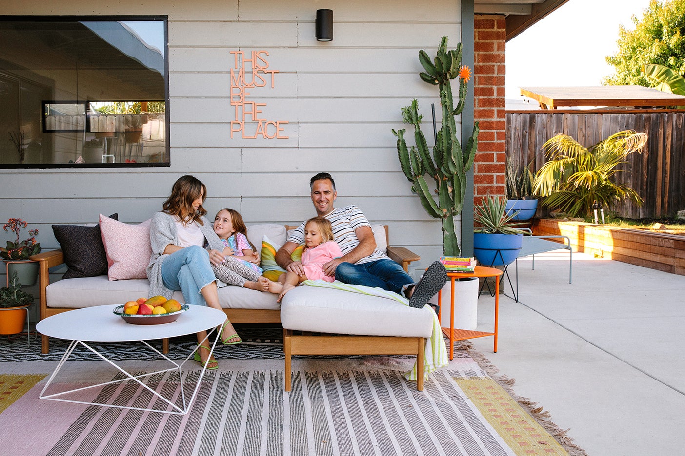 family on outdoor couch