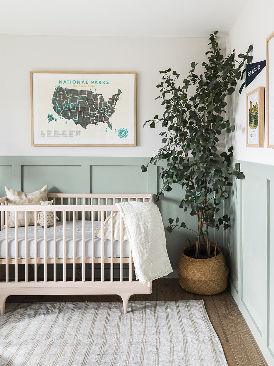 Sustainable nursery with sage green wainscoting