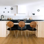black and white kitchen with wooden ribbed island