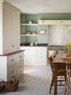 white shaker kitchen cabinets with green painted walls