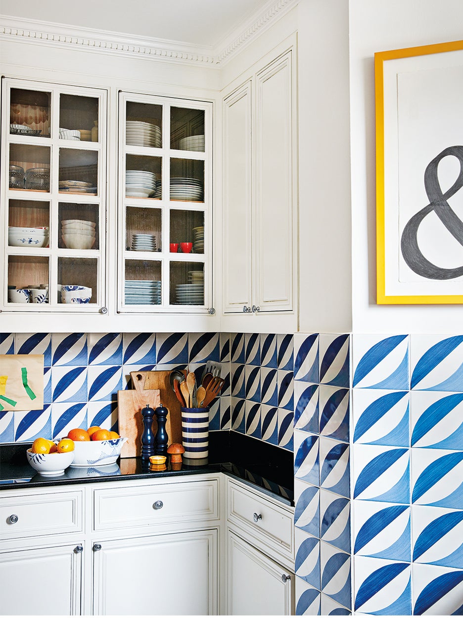white kitchen with blue tile backsplash