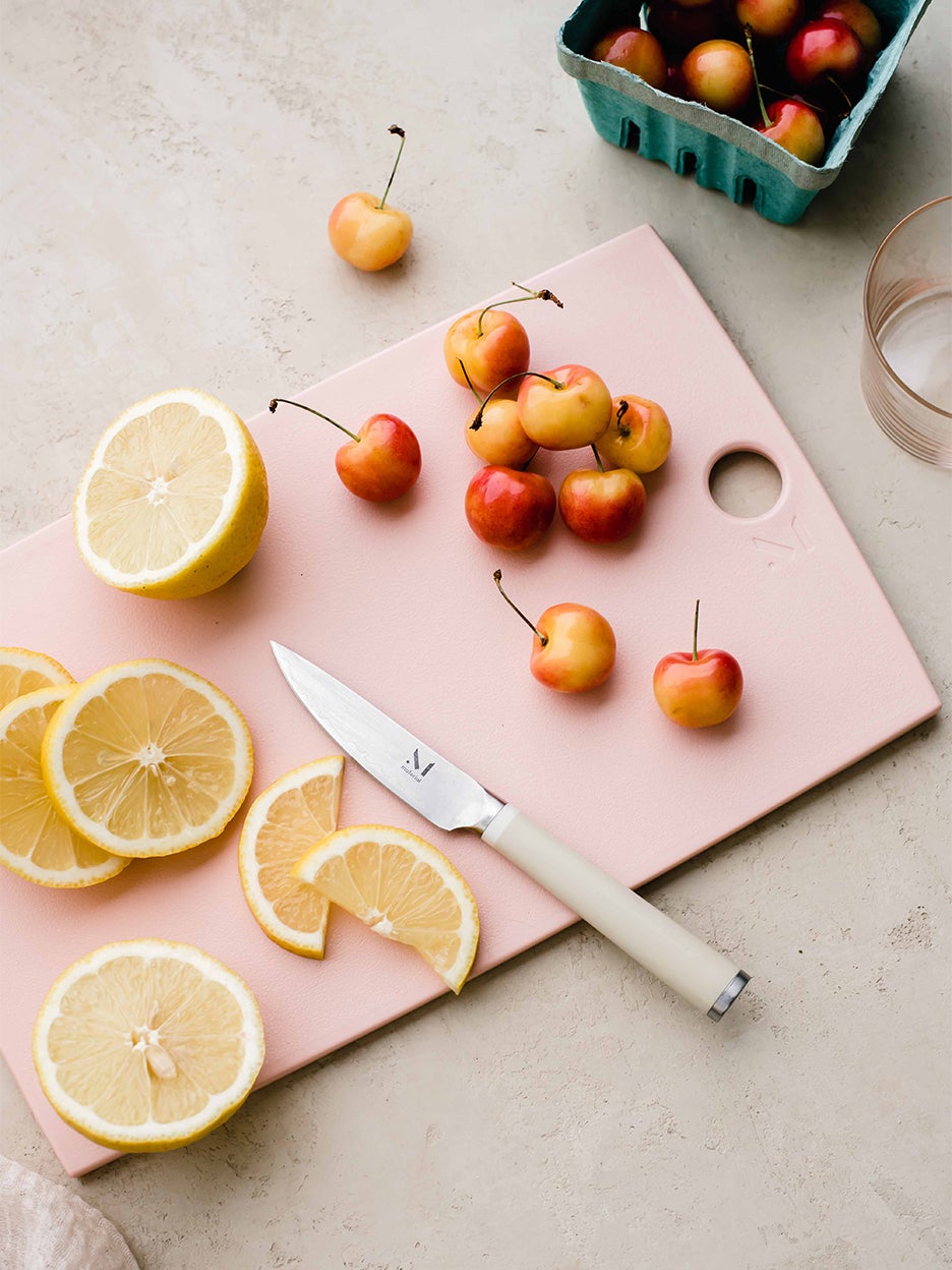 pink cutting board with fruit