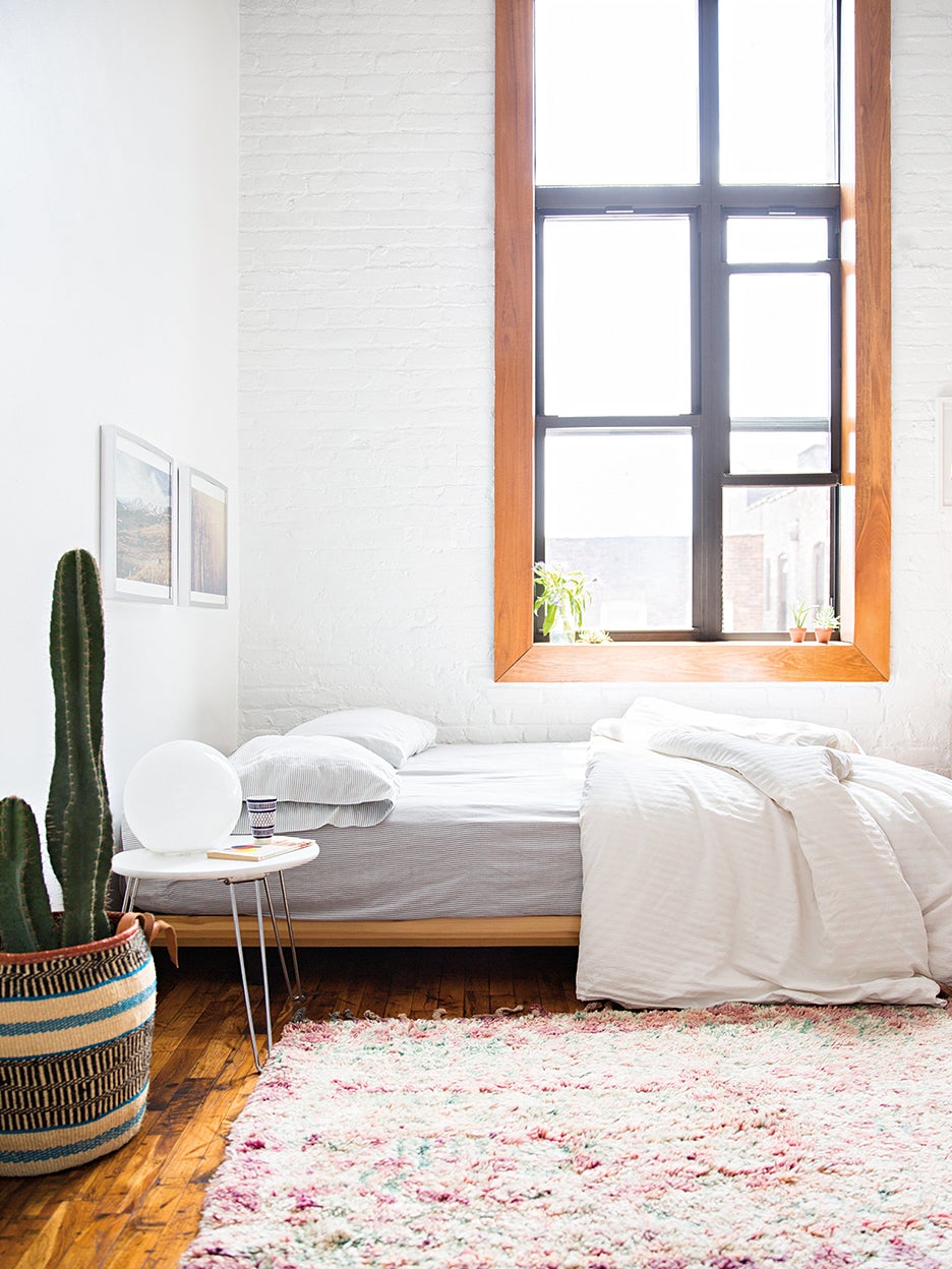 Bedroom with cactus and white walls