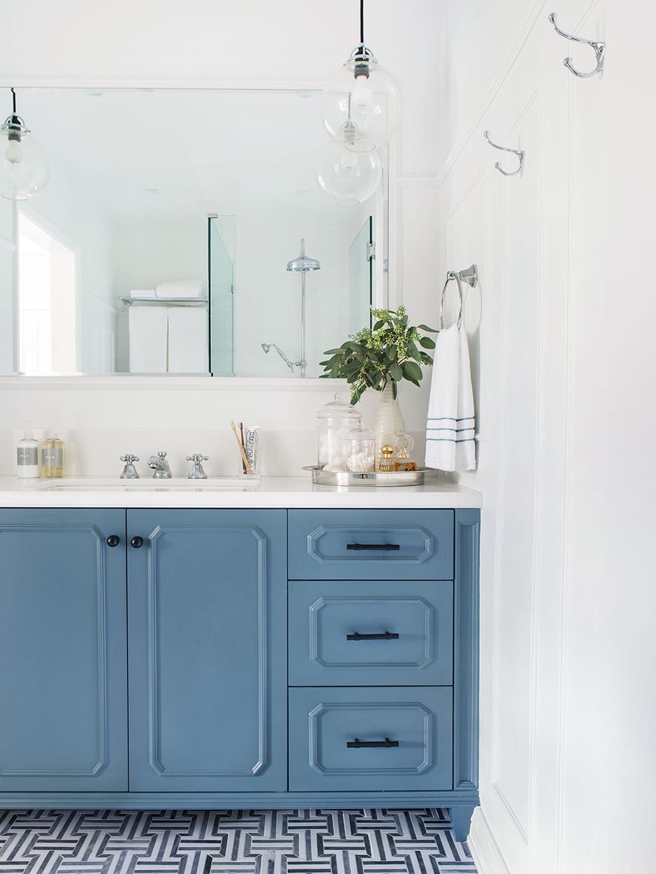 white bathroom with light blue sink unit