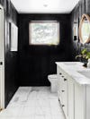 black and white bathroom with marble floor