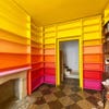 orange, yellow, pink ombre bookcases