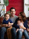Natalie and Chris Bruss at home with their kids