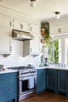 Traditional kitchen with blue lower cabinets
