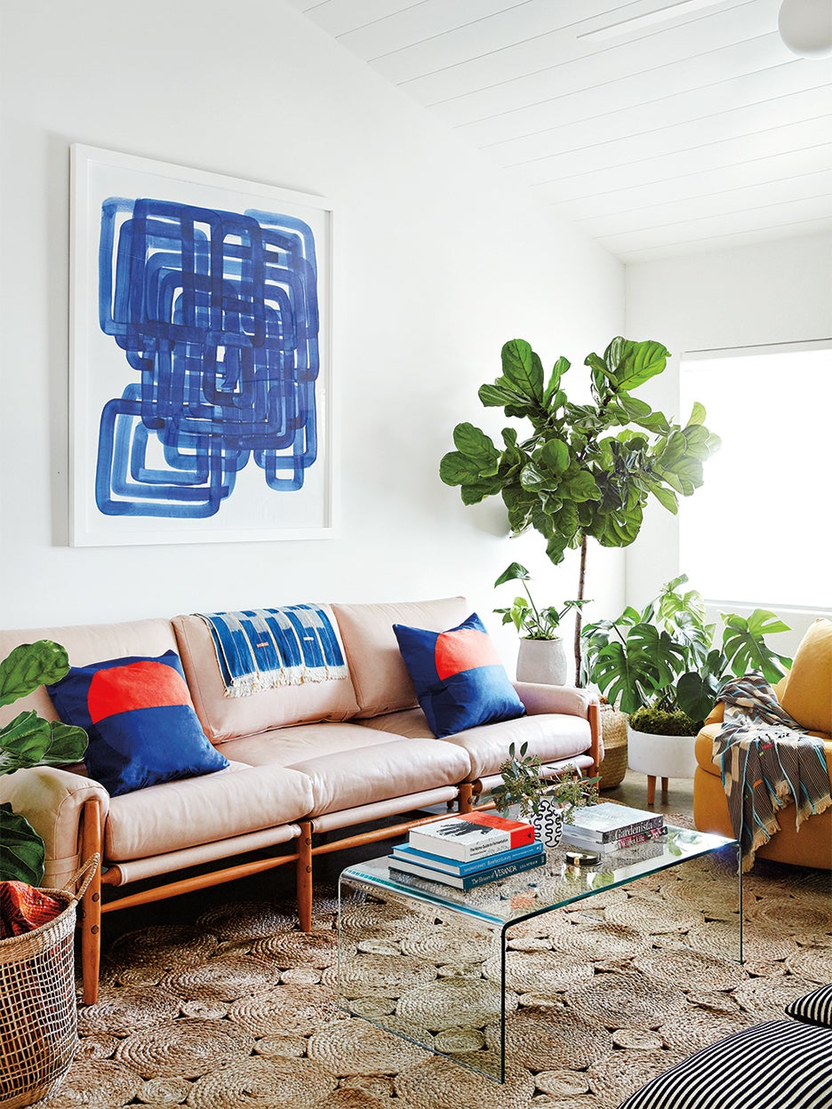small living room with blue art
