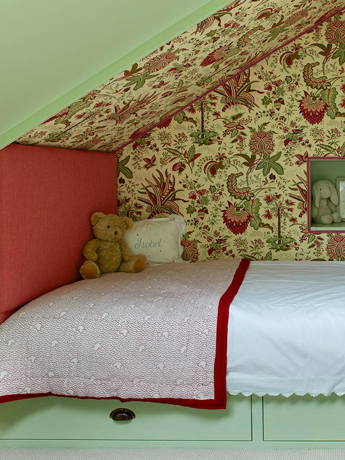 Kids built-in bed nook with floral fabric walls
