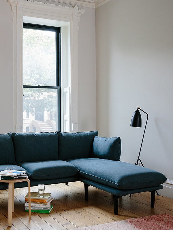 blue sofa in white living room