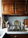 wooden antique kitchen cabinets with blue wall paint