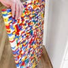 hand holding lego wall