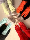 Hands wearing cleaning gloves
